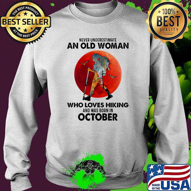Never underestimate an old woman who loves hiking and was born in october blood moon s Sweater Never underestimate an old woman who loves hiking and was born in october blood moon s Sweater