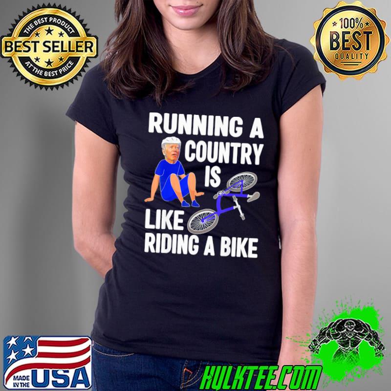 Biden falls off bike Joe Biden falling off his bicycle Running a country s Ladies Tee Biden falls off bike Joe Biden falling off his bicycle Running a country s Ladies Tee