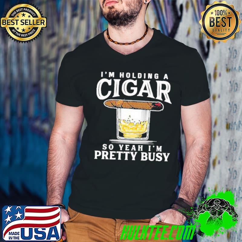 I'm holding a cigar so yeah pretty busy shirt